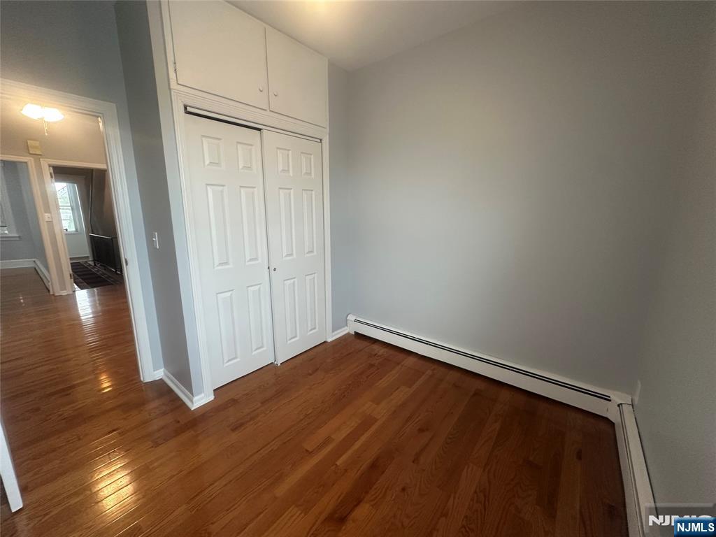159 Division Avenue, Unit 2 Garfield, NJ 07026 - Photo 10 of 14 a view of empty room with wooden floor
