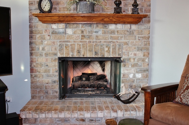 3812 Redwood Court Spring Grove, IL 60071 - Photo 15 of 37 a room with fireplace and chair