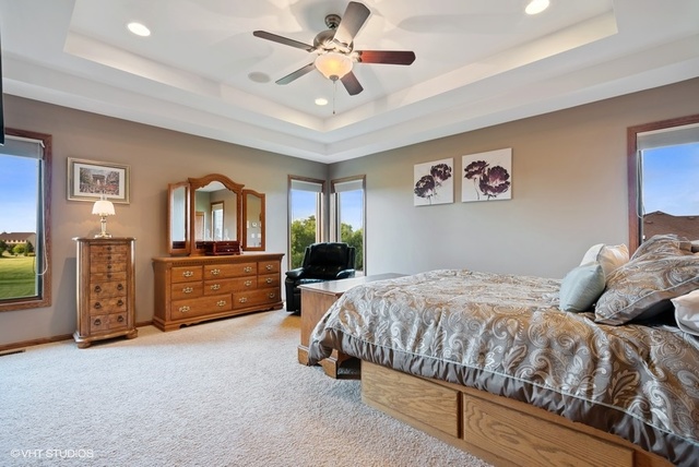 3812 Redwood Court Spring Grove, IL 60071 - Photo 19 of 37 a bedroom with a bed and dresser