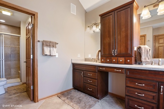 3812 Redwood Court Spring Grove, IL 60071 - Photo 20 of 37 a bathroom with a double vanity sink and mirror