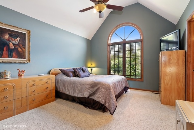 3812 Redwood Court Spring Grove, IL 60071 - Photo 22 of 37 a bedroom with a bed and a window