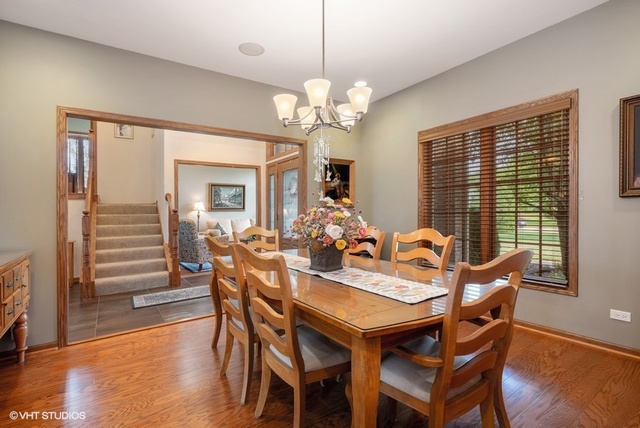 3812 Redwood Court Spring Grove, IL 60071 - Photo 8 of 37 a view of a dining room with furniture window and wooden floor