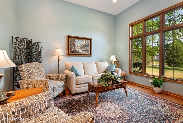 3812 Redwood Court Spring Grove, IL 60071 - Photo 9 of 37 a living room with furniture and a large window