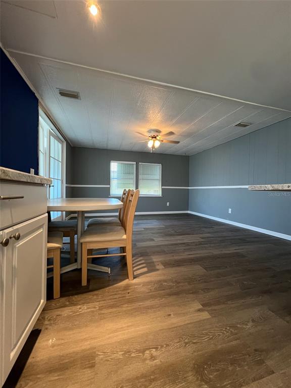6528 Roosevelt Drive Port Richey, FL 34668 - Photo 13 of 42 a view of a room with furniture and a kitchen
