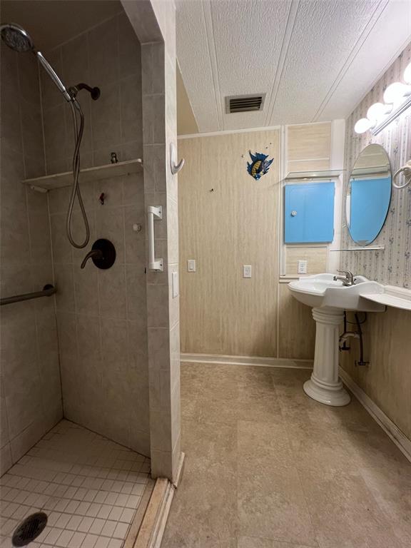 6528 Roosevelt Drive Port Richey, FL 34668 - Photo 19 of 42 a bathroom with a sink toilet and shower