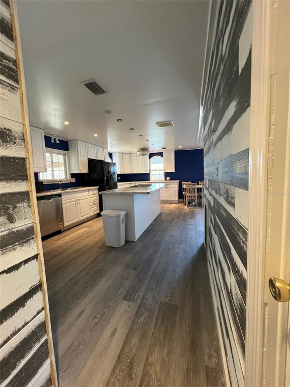 6528 Roosevelt Drive Port Richey, FL 34668 - Photo 22 of 42 a kitchen with granite countertop lots of counter top space and stainless steel appliances