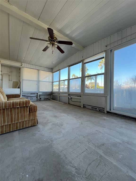 6528 Roosevelt Drive Port Richey, FL 34668 - Photo 29 of 42 a view of a livingroom with furniture and a ceiling fan