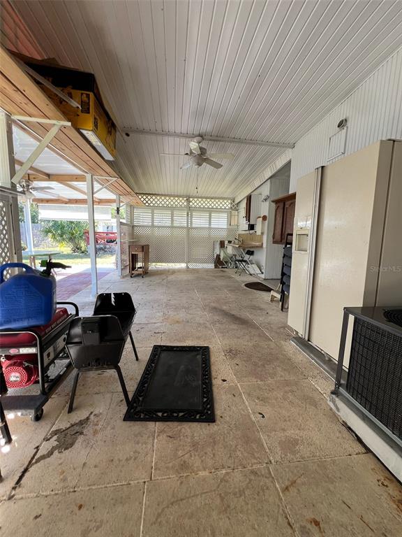 6528 Roosevelt Drive Port Richey, FL 34668 - Photo 34 of 42 a room with furniture and a large window