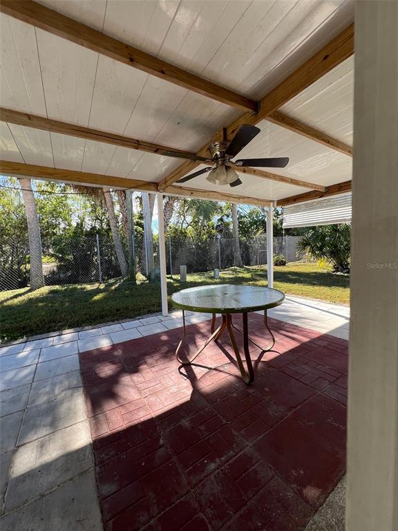 6528 Roosevelt Drive Port Richey, FL 34668 - Photo 37 of 42 a view of a swimming pool with a bench in patio