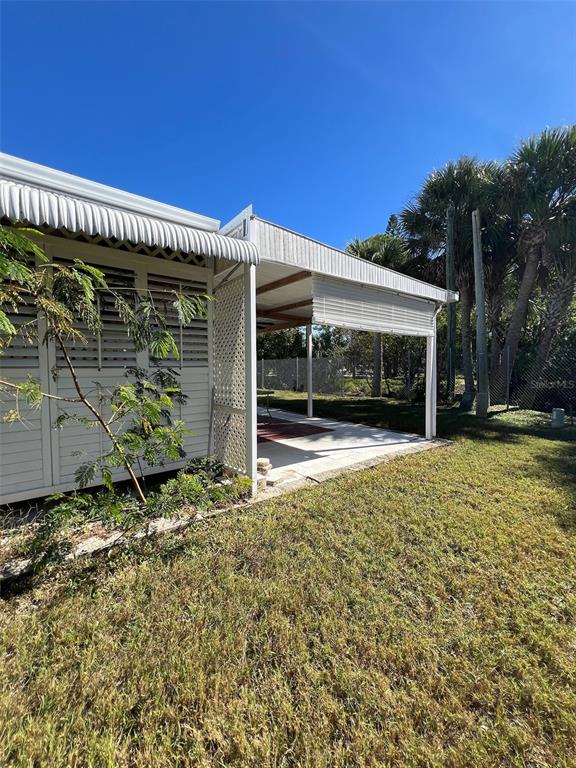 6528 Roosevelt Drive Port Richey, FL 34668 - Photo 38 of 42 front view of a house with a yard