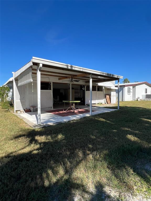 6528 Roosevelt Drive Port Richey, FL 34668 - Photo 40 of 42 a view of a house with backyard porch and garden