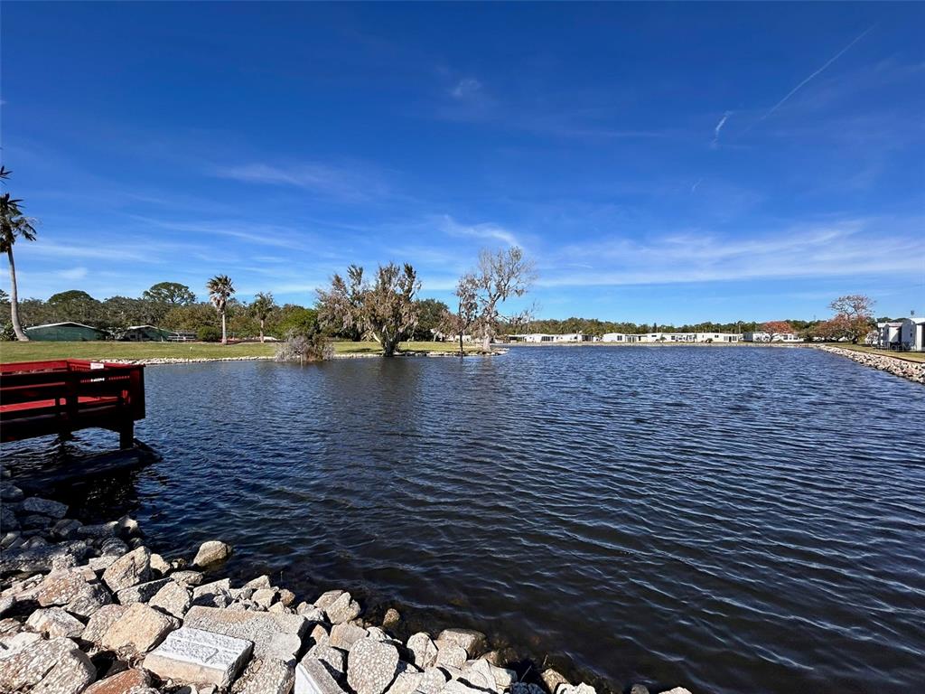 6528 Roosevelt Drive Port Richey, FL 34668 - Photo 8 of 42 a view of a lake with sunset