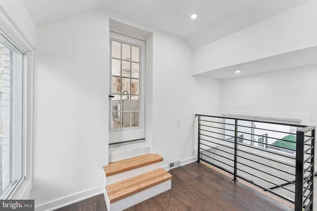 a view of entryway with wooden floor