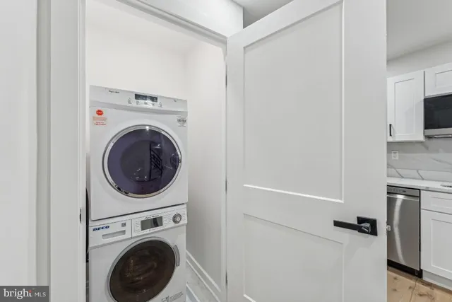 a view of a kitchen with washer and dryer