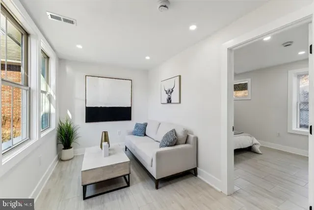 a kitchen with stainless steel appliances a refrigerator sink and cabinets