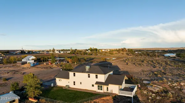 a view of entryway with furniture and wooden floor