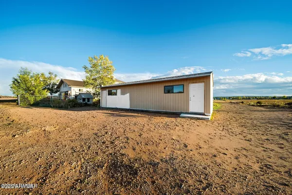 a kitchen with stainless steel appliances granite countertop a stove and a refrigerator