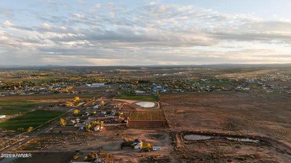 a bedroom with a bed couch and window