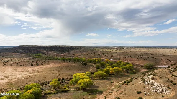 a bathroom with a bathtub sink and mirror