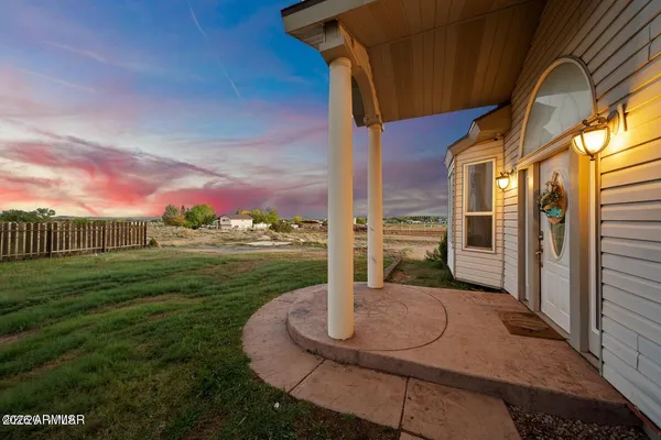 a view of a house with a yard and garage