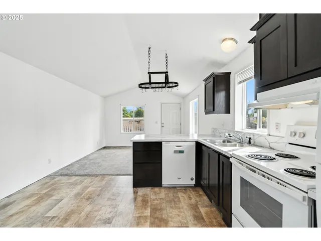 a view of a hallway with white walls