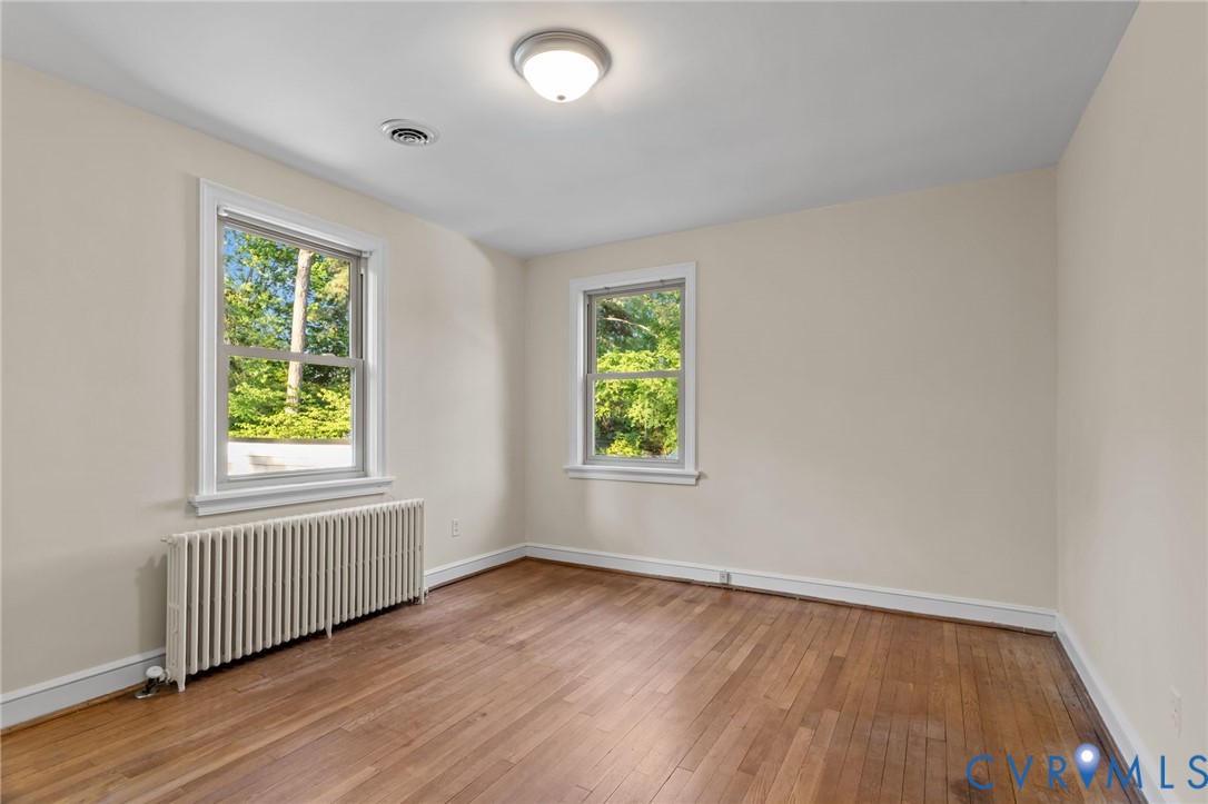 4804 Morrison Road Richmond, VA 23230 - Photo 29 of 48 an empty room with wooden floor and windows