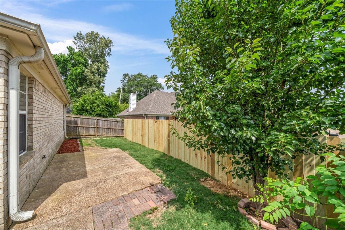 6972 Wynne Ridge Road North Cordova, TN 38016 - Photo 21 of 23 Fenced backyard with a patio area