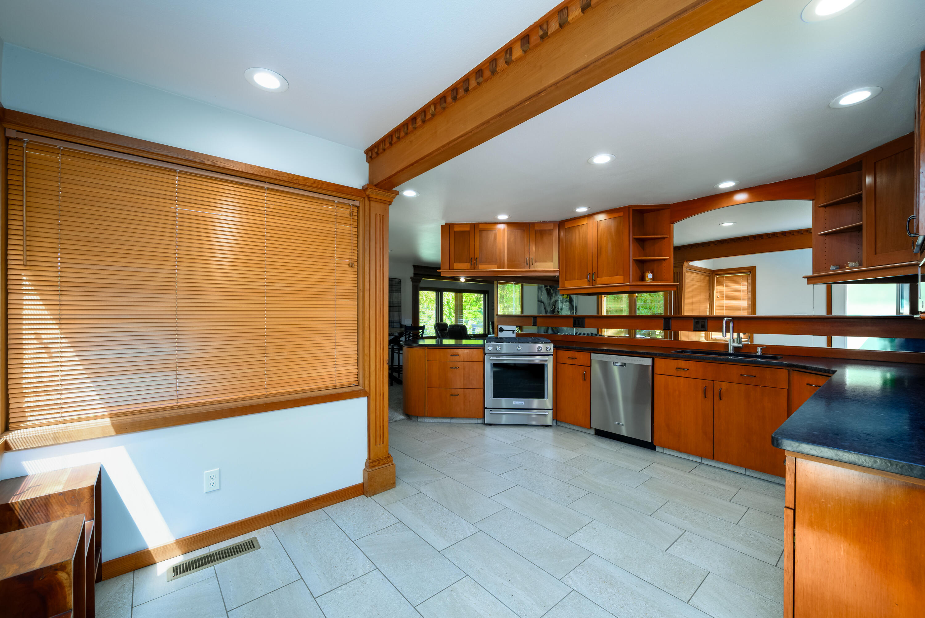 2546 Fisher Road Roseburg, OR 97471 - Photo 17 of 59 a kitchen with stainless steel appliances kitchen island granite countertop a stove a sink and a refrigerator