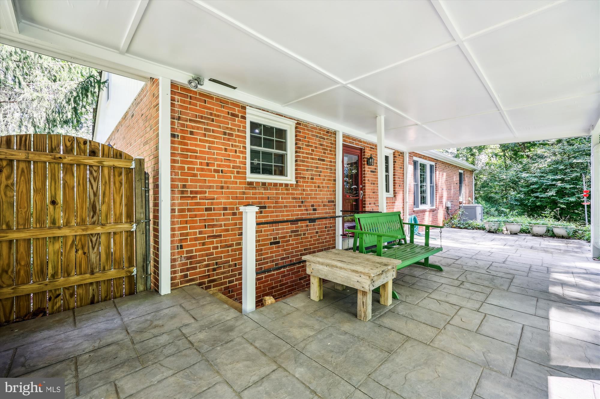 111 Ednor Road Silver Spring, MD 20905 - Photo 15 of 36 a backyard of a house with a bench and chairs
