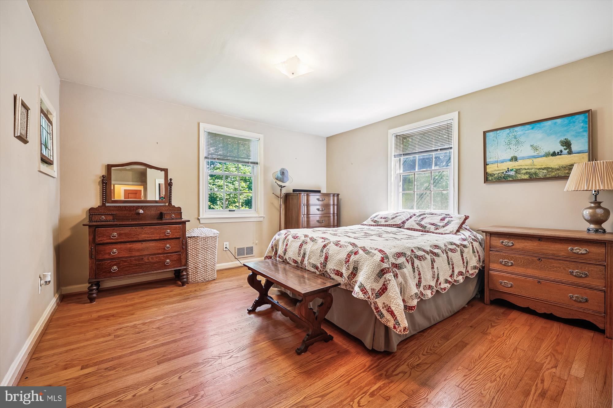 111 Ednor Road Silver Spring, MD 20905 - Photo 19 of 36 a bedroom with a bed and wooden floor