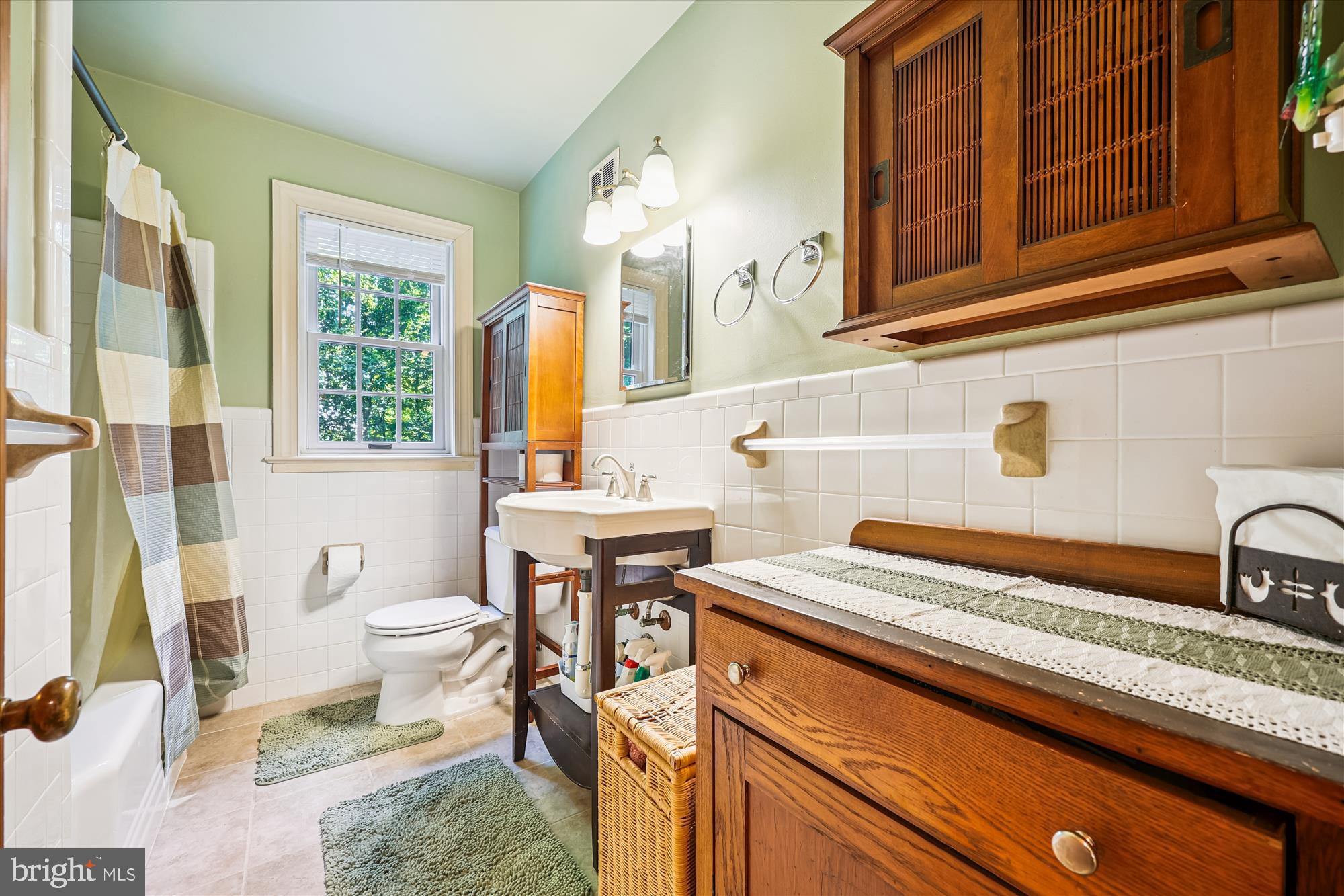 111 Ednor Road Silver Spring, MD 20905 - Photo 20 of 36 a bathroom with a sink a toilet and a mirror
