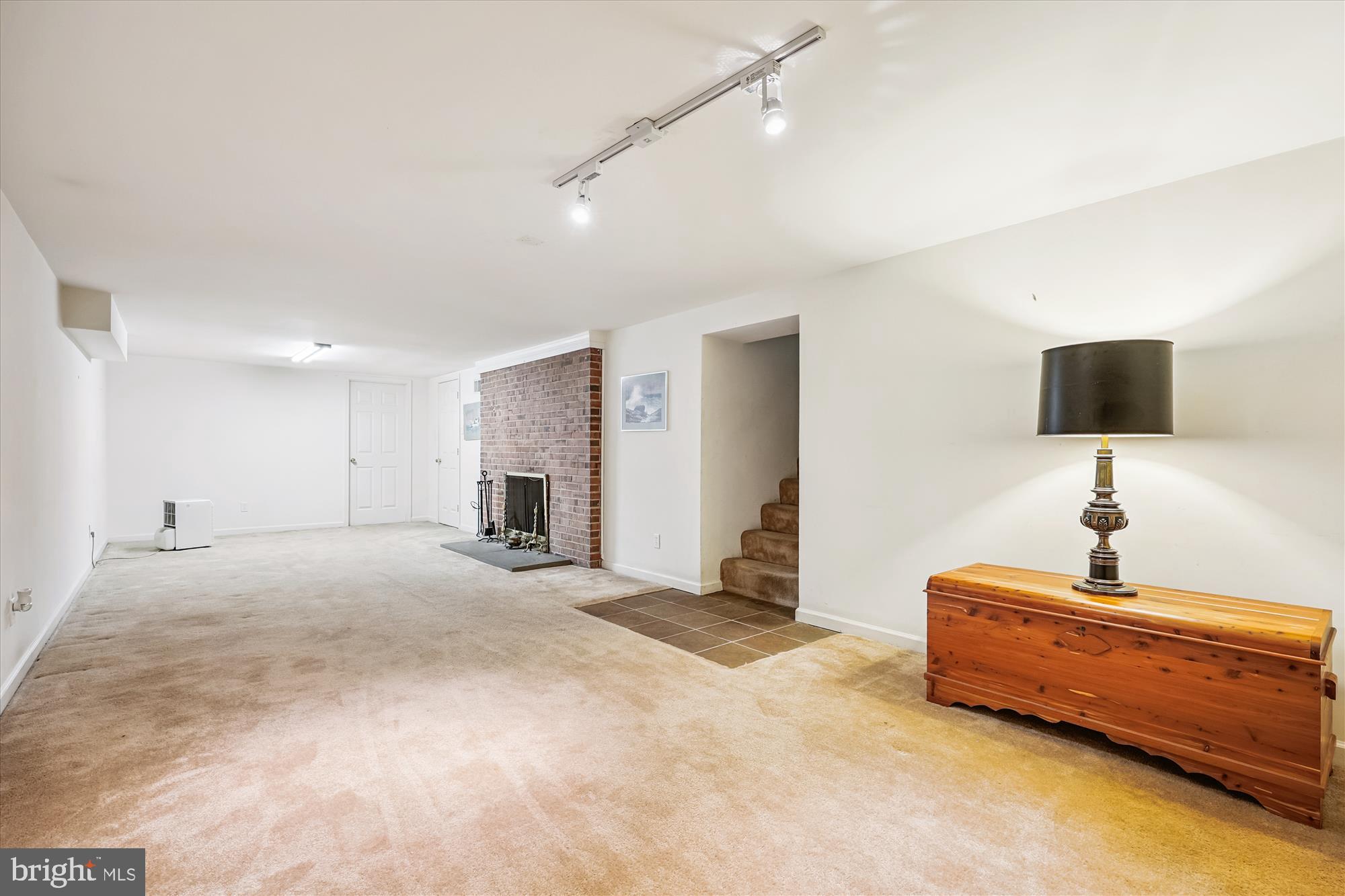 111 Ednor Road Silver Spring, MD 20905 - Photo 21 of 36 a spacious bedroom with a bed and a flat screen tv