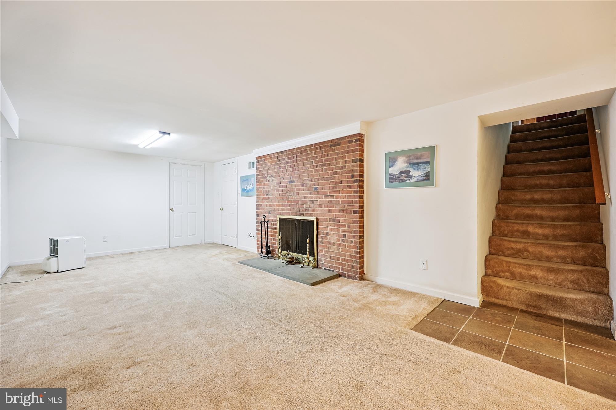 111 Ednor Road Silver Spring, MD 20905 - Photo 31 of 36 a view of an empty room with a fireplace