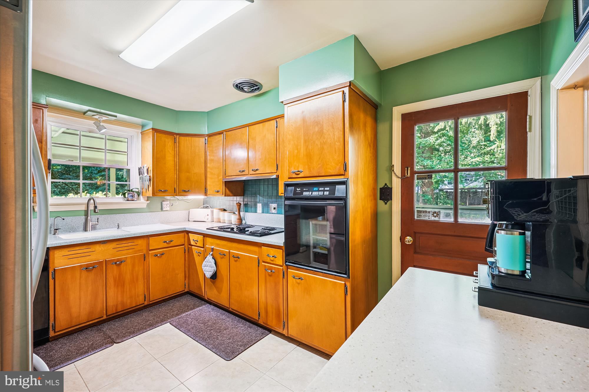 111 Ednor Road Silver Spring, MD 20905 - Photo 32 of 36 a kitchen with stainless steel appliances granite countertop a refrigerator and a sink