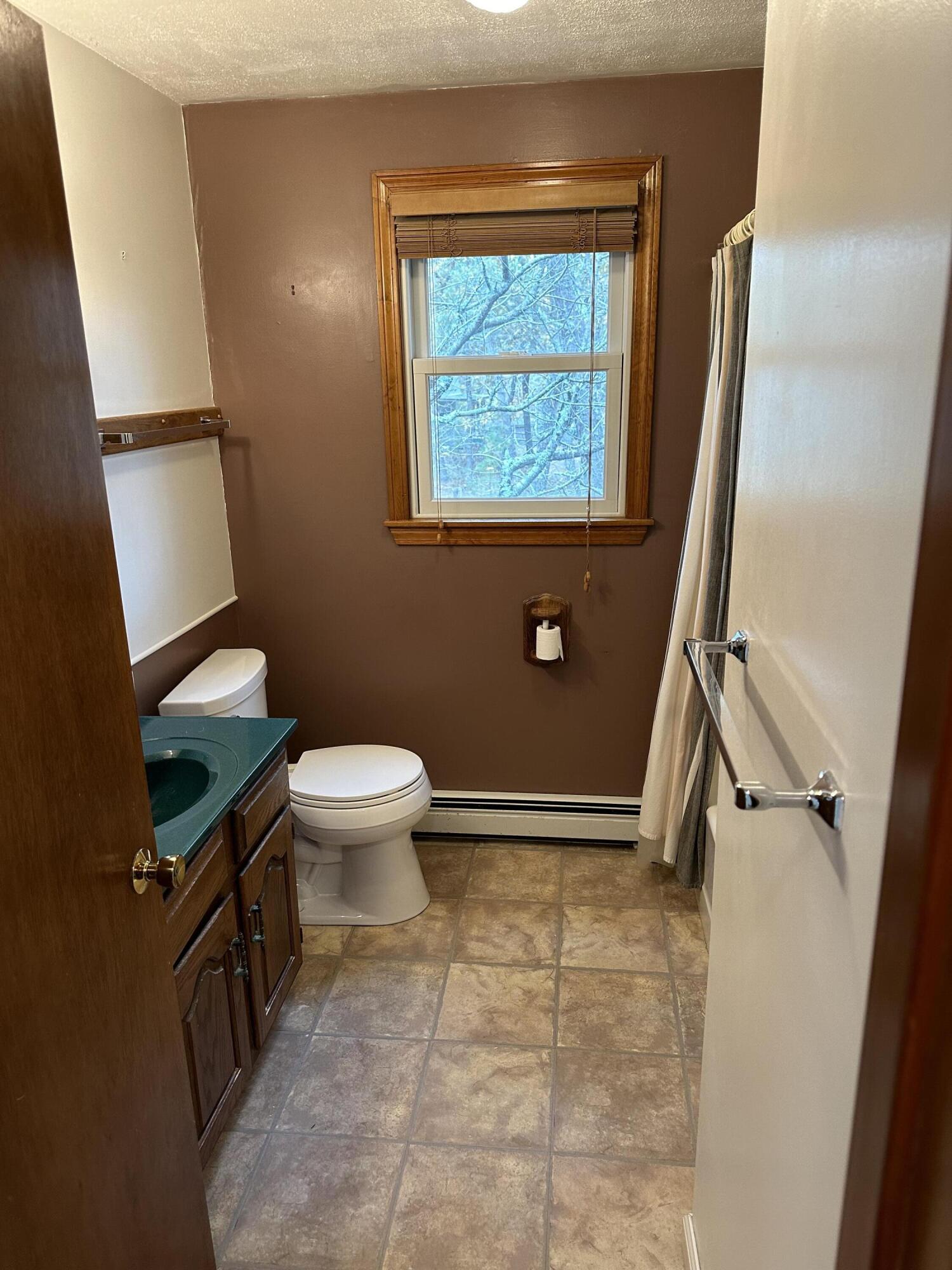 16 Warren Road Wellfleet, MA 02667 - Photo 11 of 24 a bathroom with a toilet and a shower