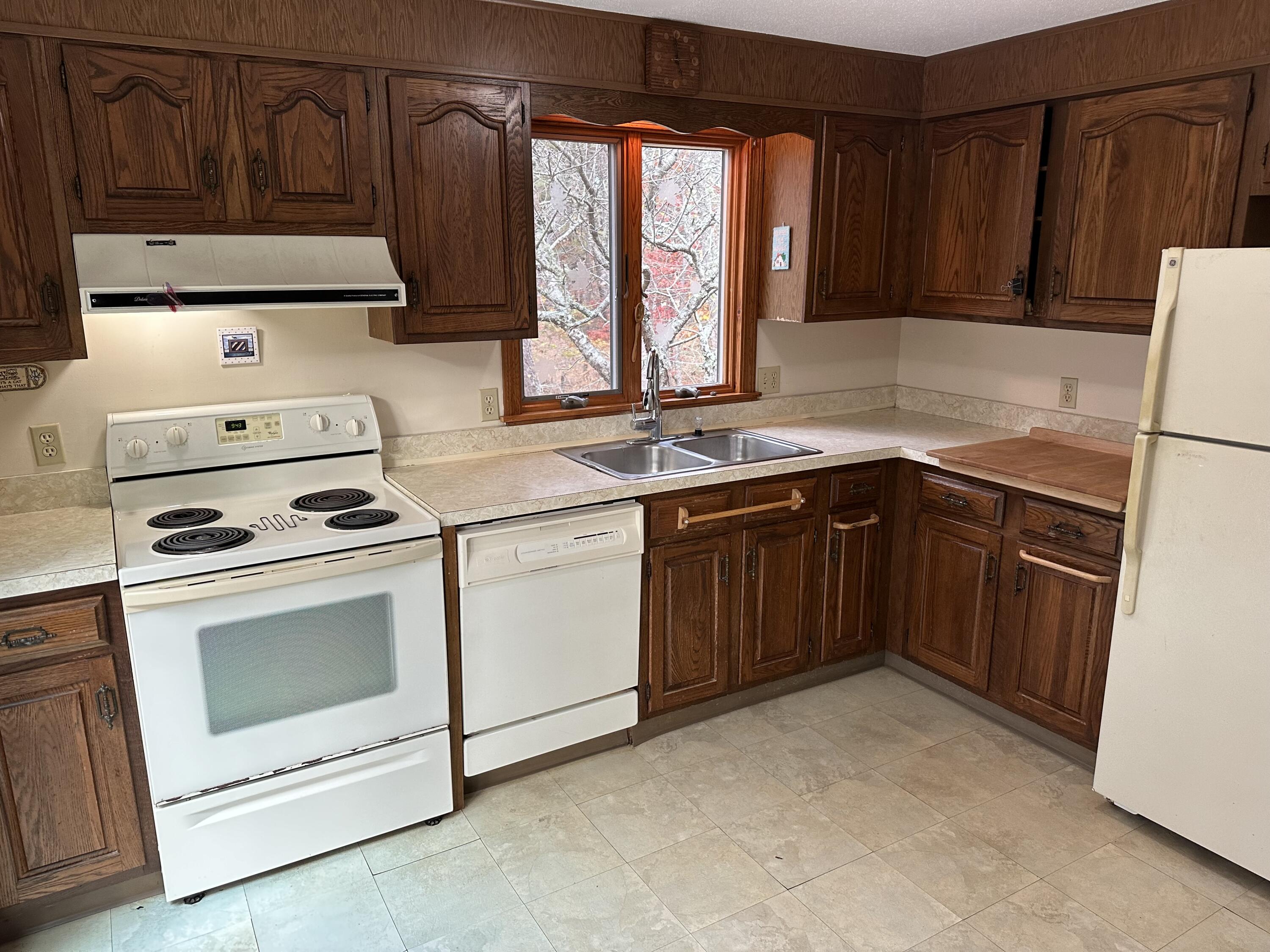 16 Warren Road Wellfleet, MA 02667 - Photo 15 of 24 a kitchen with a stove sink and cabinets