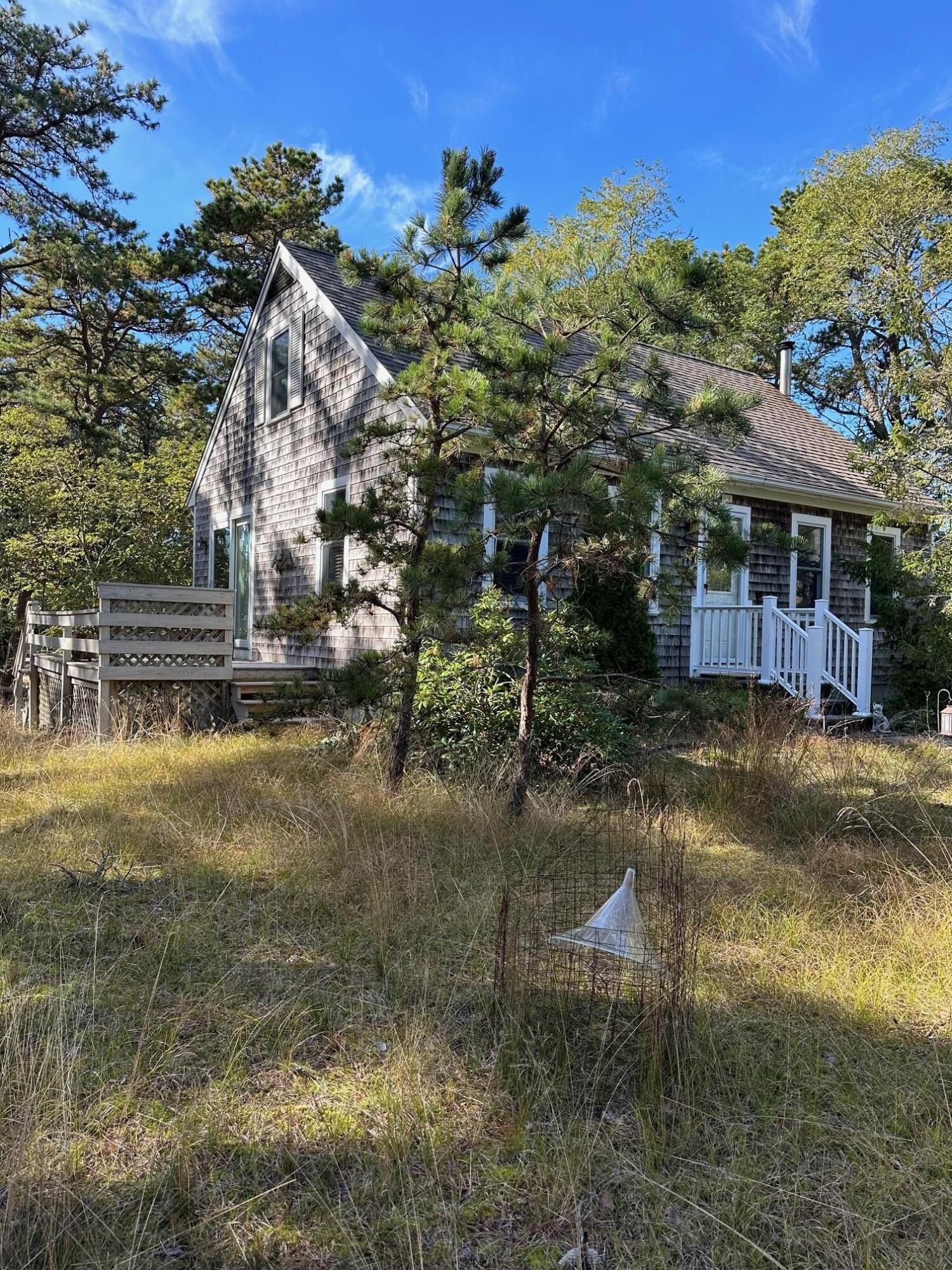 16 Warren Road Wellfleet, MA 02667 - Photo 2 of 24 a view of a house with a yard