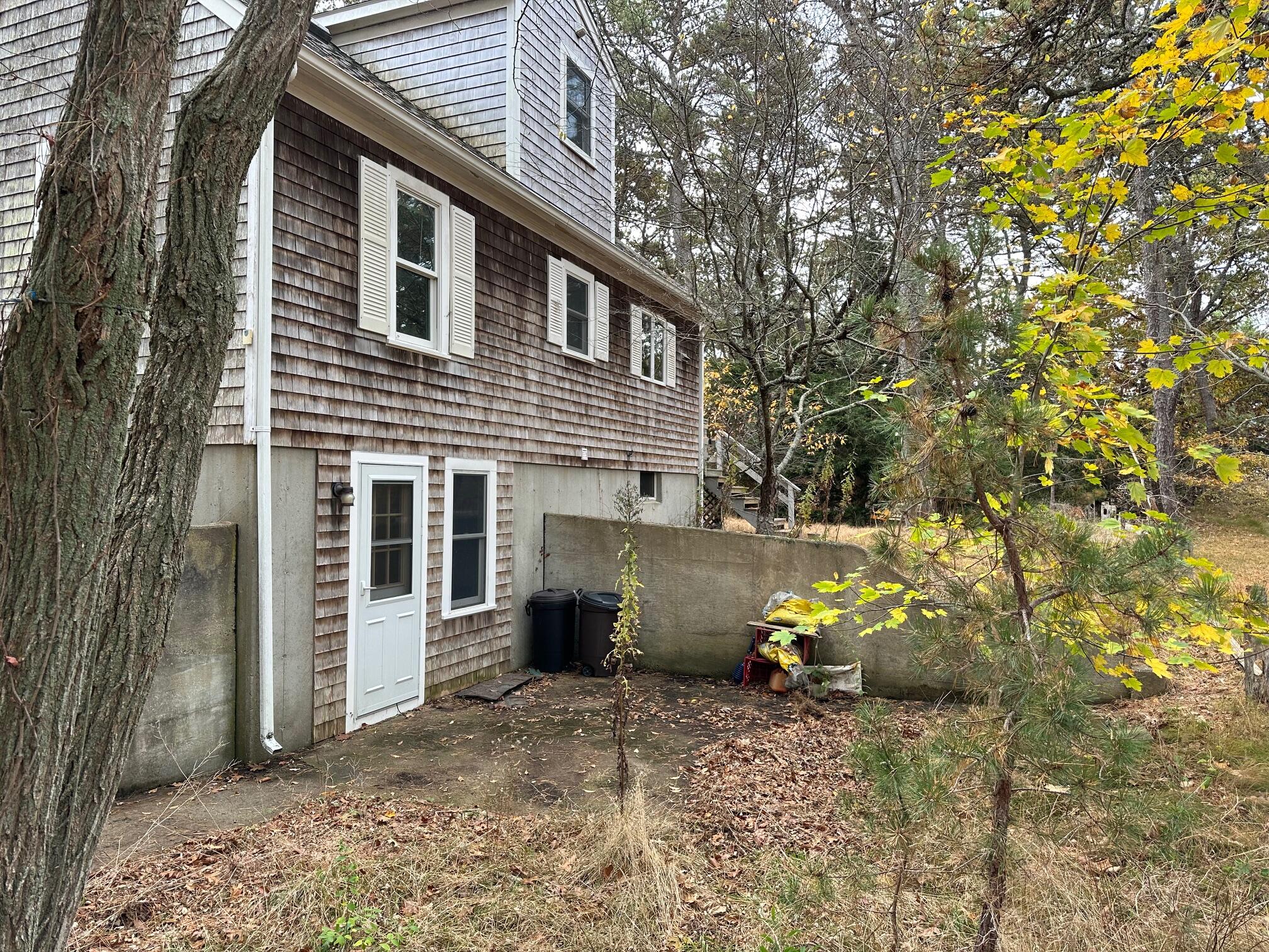 16 Warren Road Wellfleet, MA 02667 - Photo 5 of 24 a view of a house with a yard and large tree