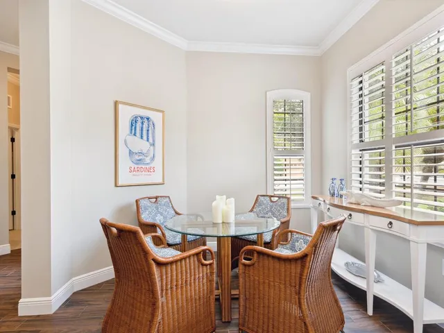 a dining room with furniture and window