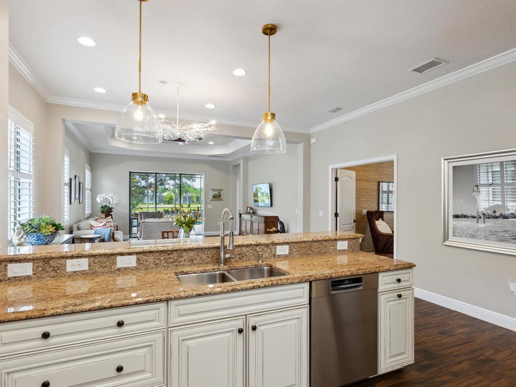 14325 Stirling Drive Lakewood Ranch, FL 34202 - Photo 20 of 53 a kitchen with center island and large windows