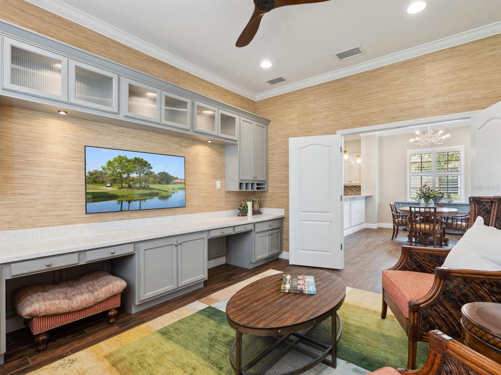 14325 Stirling Drive Lakewood Ranch, FL 34202 - Photo 22 of 53 a living room with furniture and a table