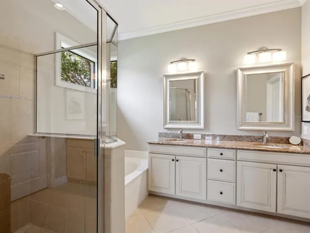 a bathroom with a granite countertop sink mirror and a