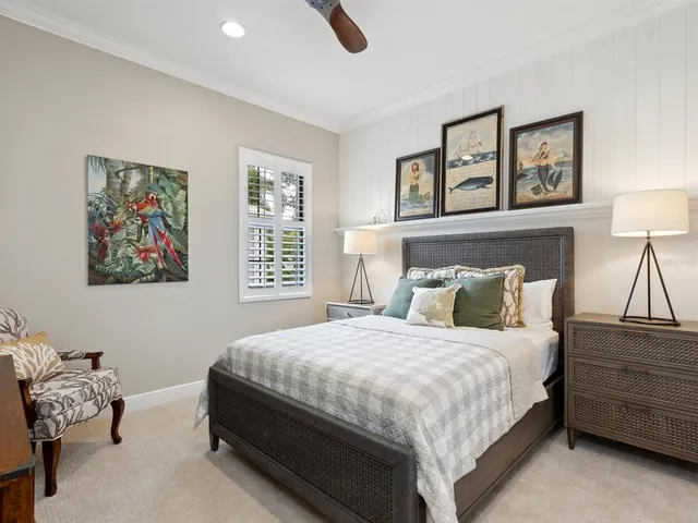 a bedroom with a bed and a painting on the wall