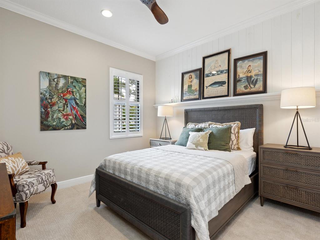 14325 Stirling Drive Lakewood Ranch, FL 34202 - Photo 28 of 53 a bedroom with a bed and a painting on the wall