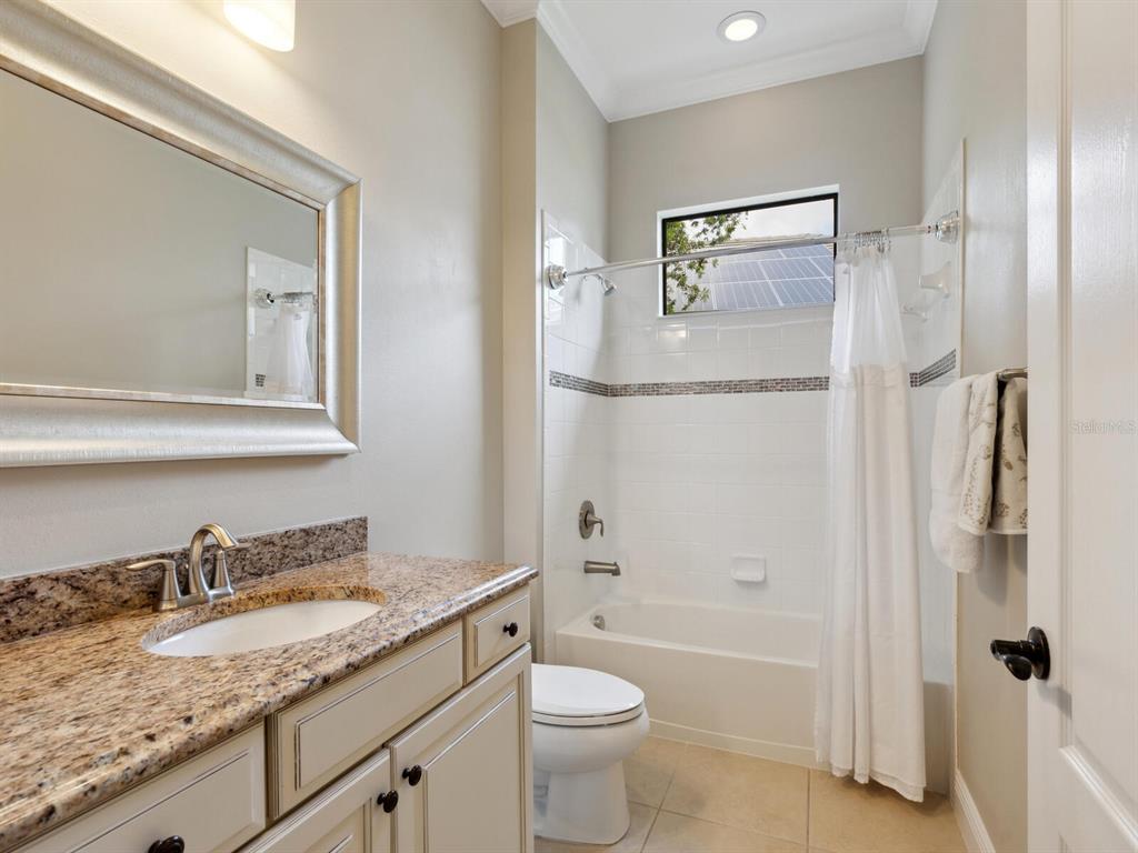 14325 Stirling Drive Lakewood Ranch, FL 34202 - Photo 29 of 53 a bathroom with a granite countertop sink toilet and shower