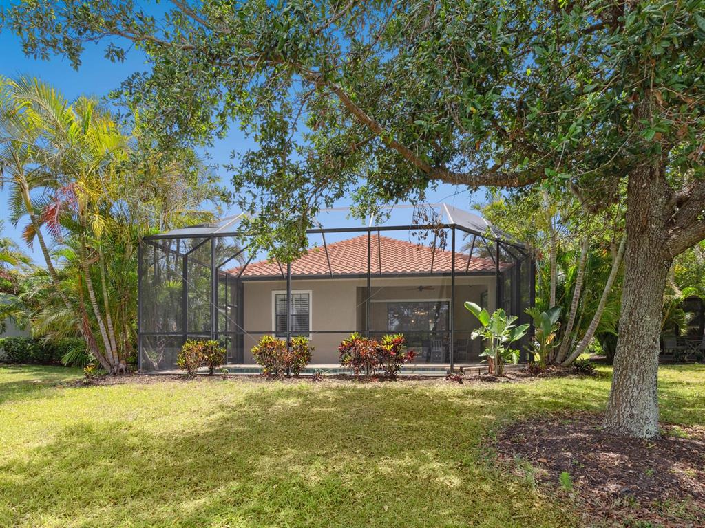 14325 Stirling Drive Lakewood Ranch, FL 34202 - Photo 32 of 53 a front view of house with yard and seating area