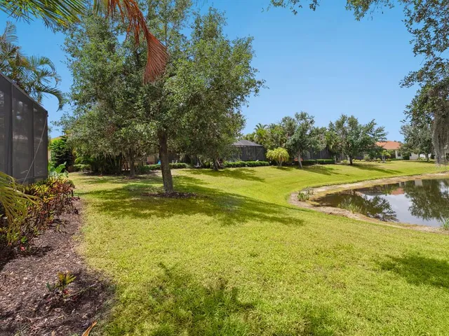 a view of a swimming pool and a yard