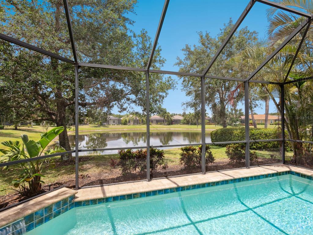 14325 Stirling Drive Lakewood Ranch, FL 34202 - Photo 4 of 53 a view of a patio with a table and chairs