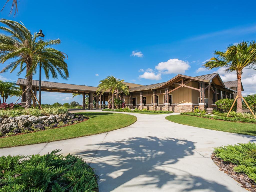 14325 Stirling Drive Lakewood Ranch, FL 34202 - Photo 44 of 53 a front view of house with yard and green space
