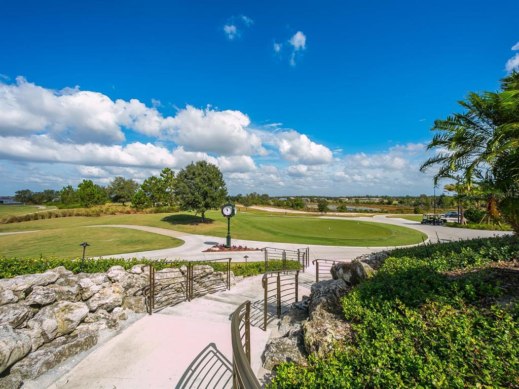 14325 Stirling Drive Lakewood Ranch, FL 34202 - Photo 46 of 53 a view of a lake and a yard